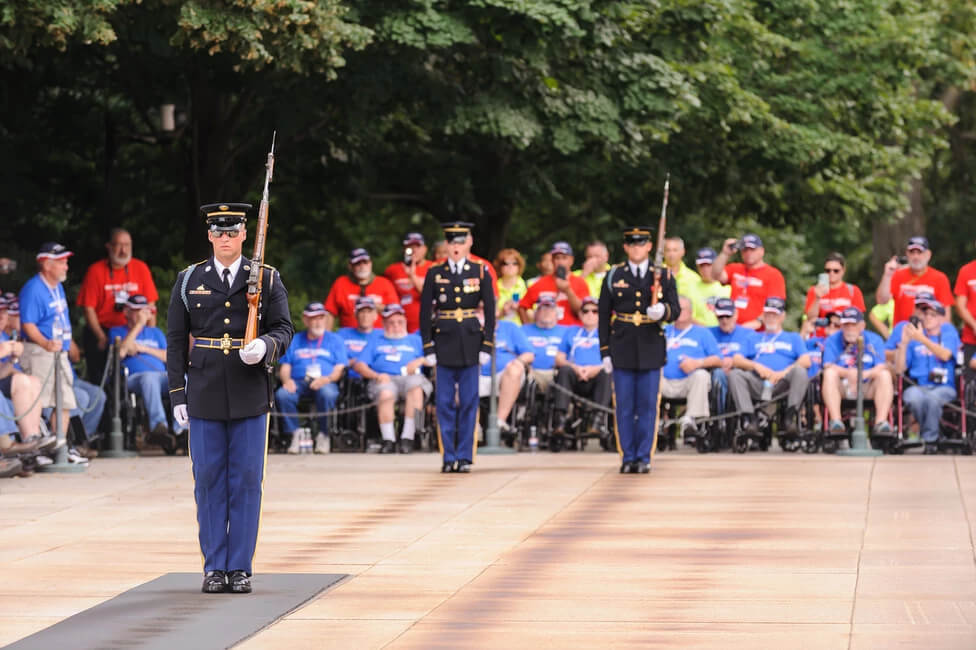 Soldiers at D.C. Memorial with Veterans and Guardians watching from the background