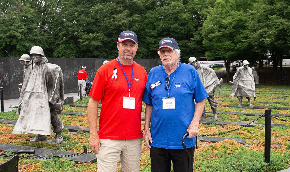 A Guardian and the Veteran he is assigned to at the Korean War Veterans Memorial